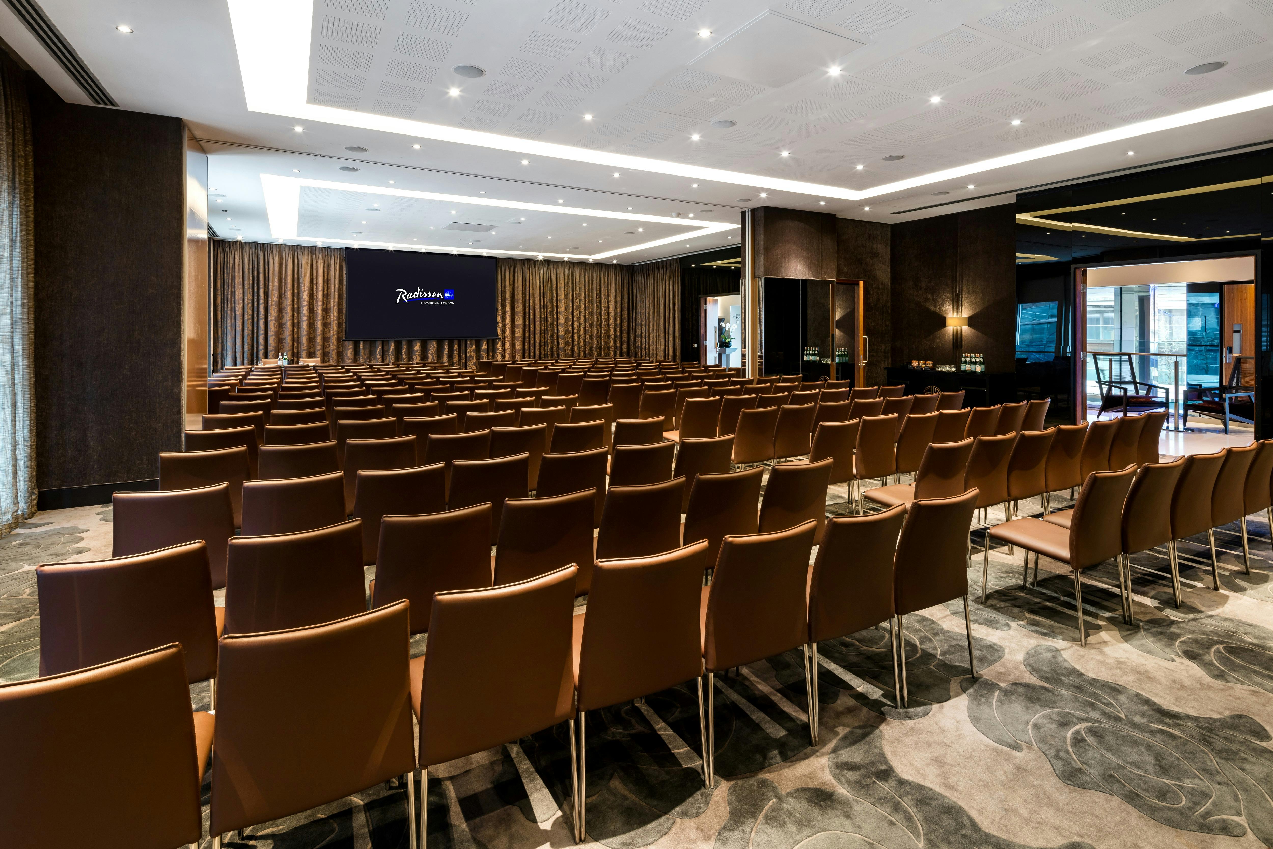 Ontario Room at Radisson Blu: modern meeting space with elegant lighting for conferences.