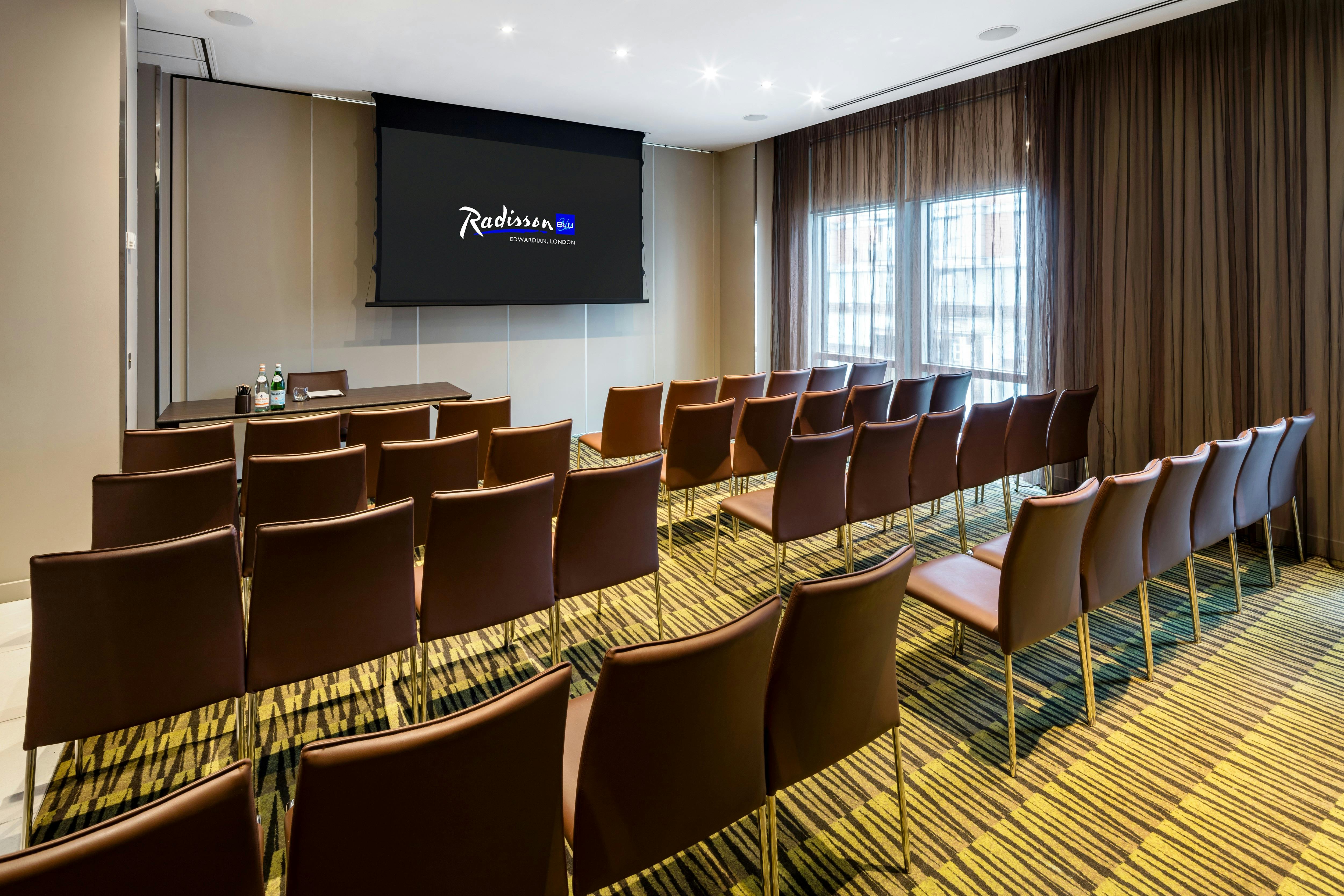 Private Room 2 at Radisson Blu: modern meeting space with natural light for corporate events.