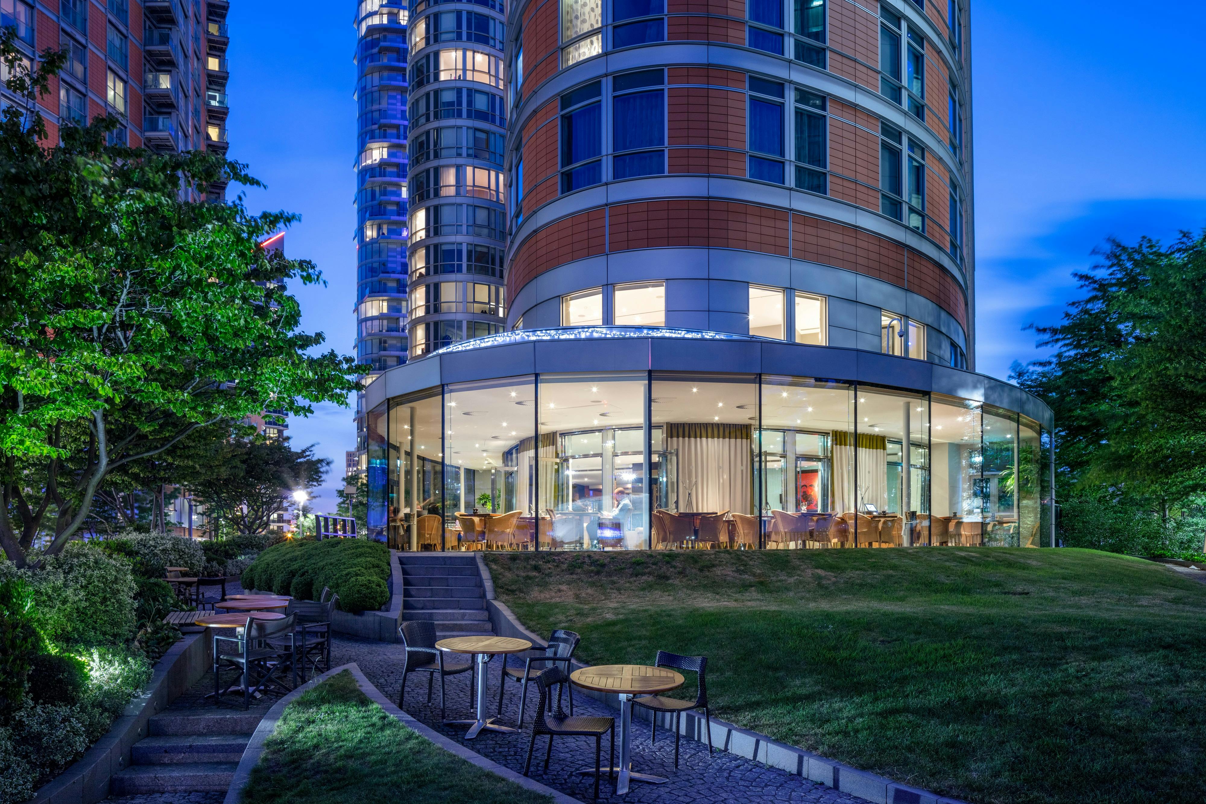 Private Room 4 at Radisson Blu, modern venue with glass exterior for upscale events.
