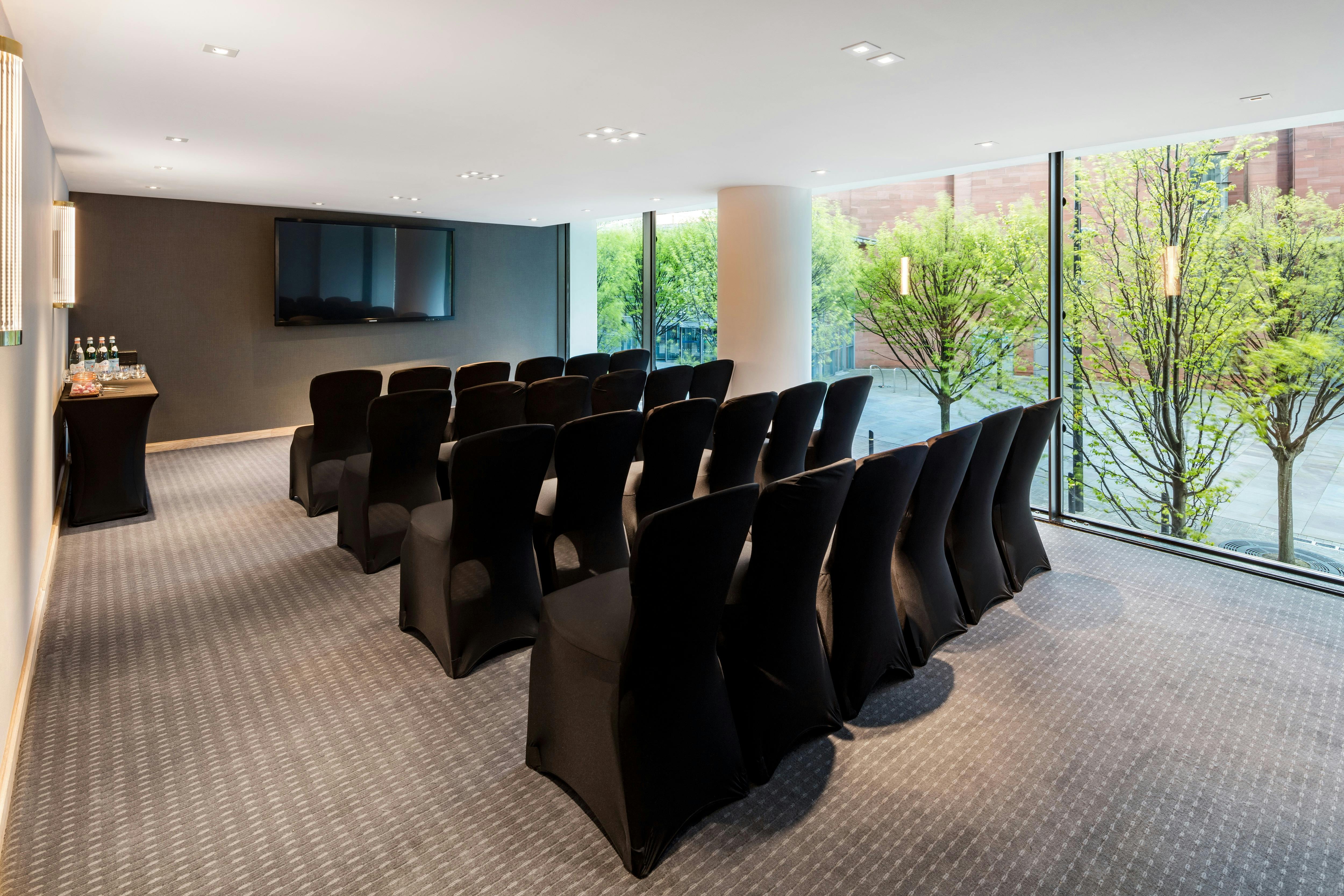 Modern meeting room with sleek chairs, ideal for corporate events and workshops.