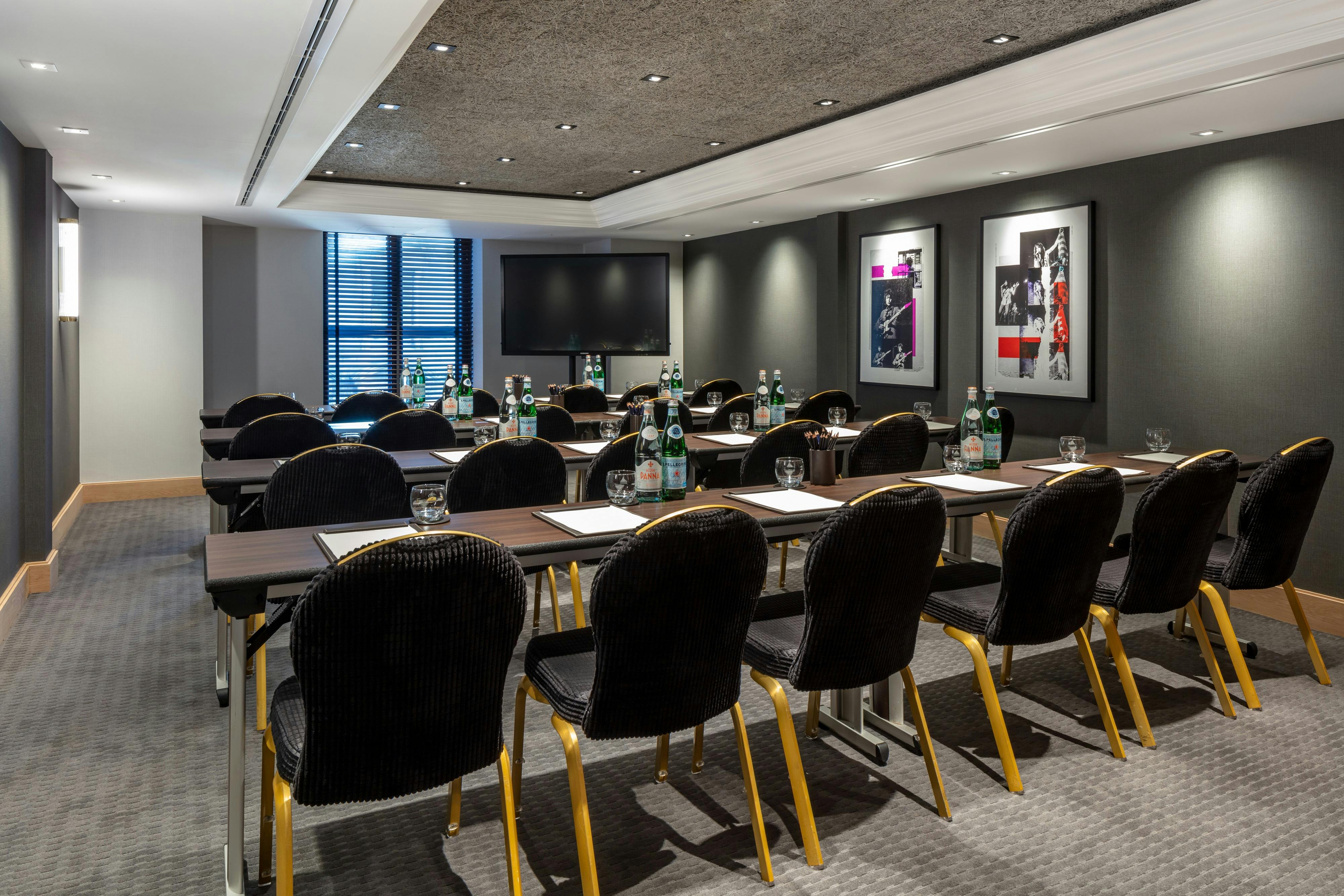 Modern meeting room with natural light at The Edwardian Manchester hotel.