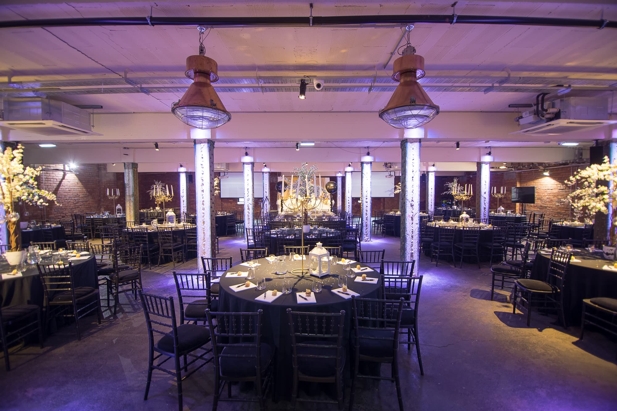 Elegant event space at The Cellars, Victoria Warehouse, set for a formal dinner. - Banner