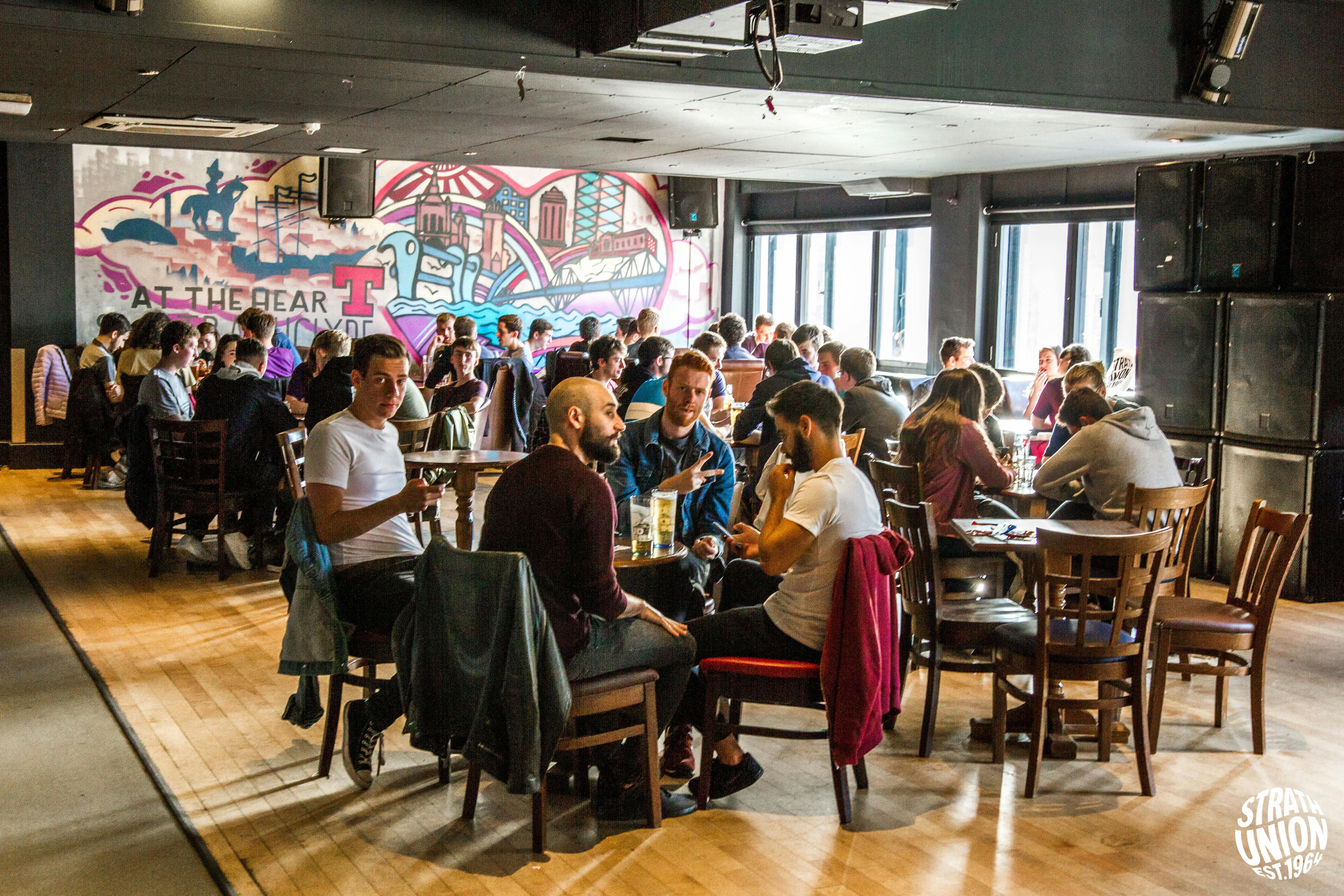 Vibrant Barony Bar at University of Strathclyde, ideal for networking events and gatherings.