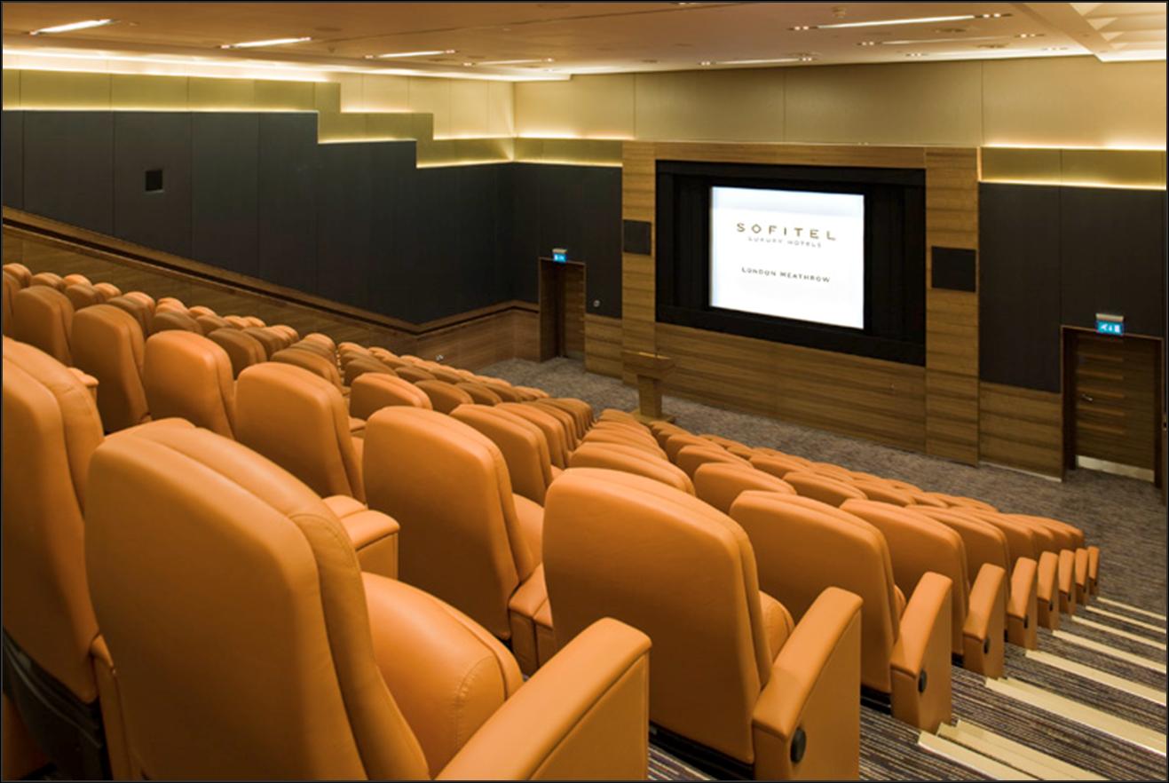 Modern Arora Theatre auditorium at Sofitel London Heathrow for corporate events and presentations.