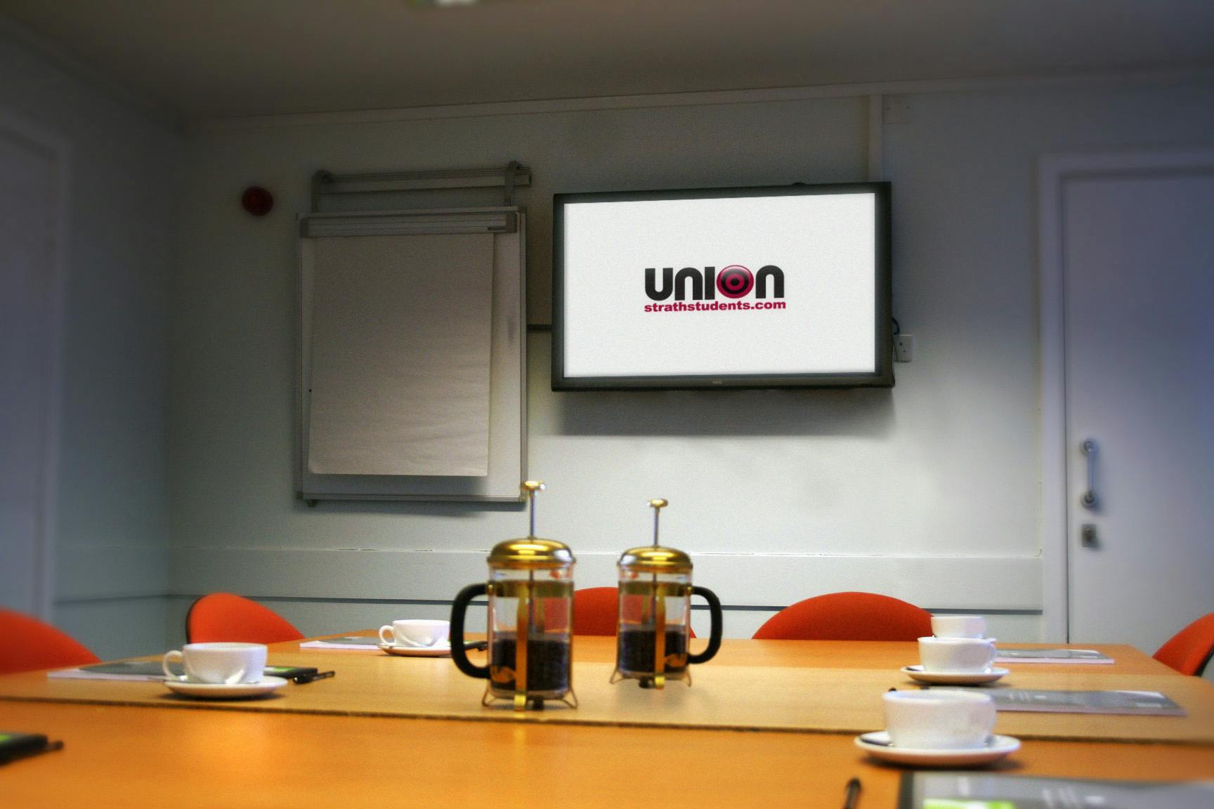 Meeting room at University of Strathclyde with coffee setup for professional events.