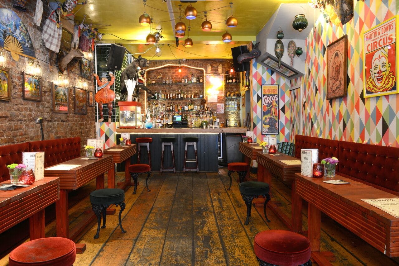 Vibrant Cirque venue with colorful decor for casual gatherings and themed events.
