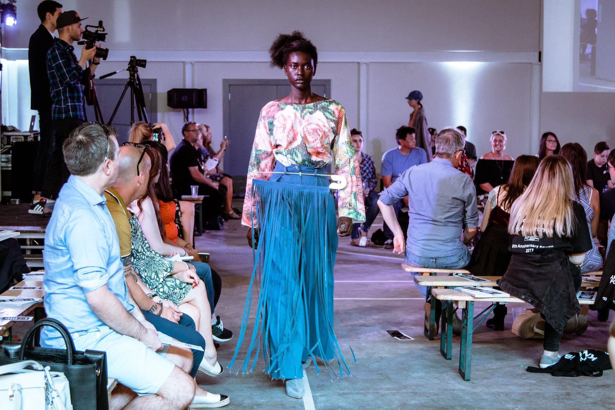 Fashion runway event at Hinterlands Event Hall with stylish lighting and seating.