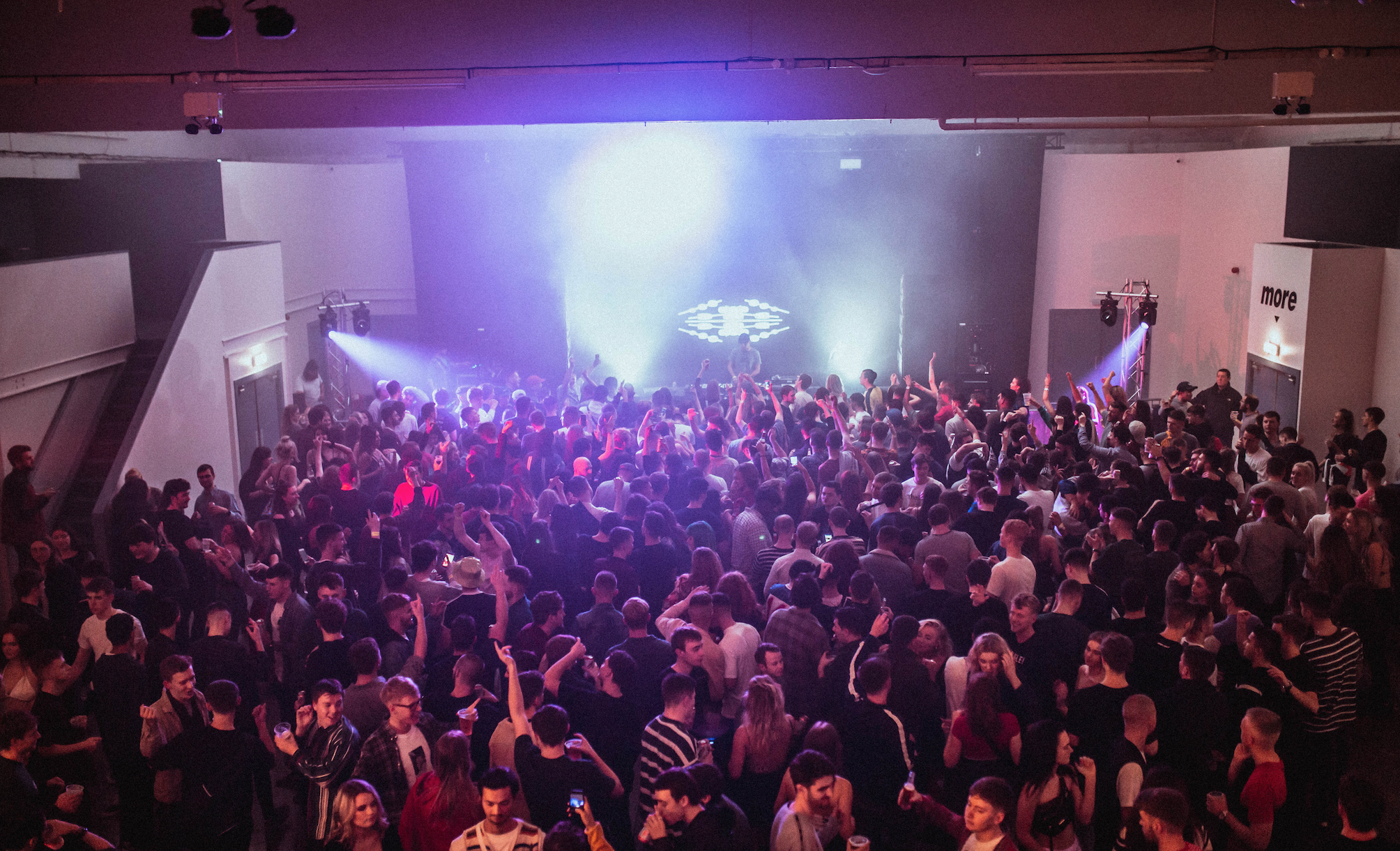 Vibrant crowd at Hinterlands Event Hall, ideal for concerts and dance parties. - Banner