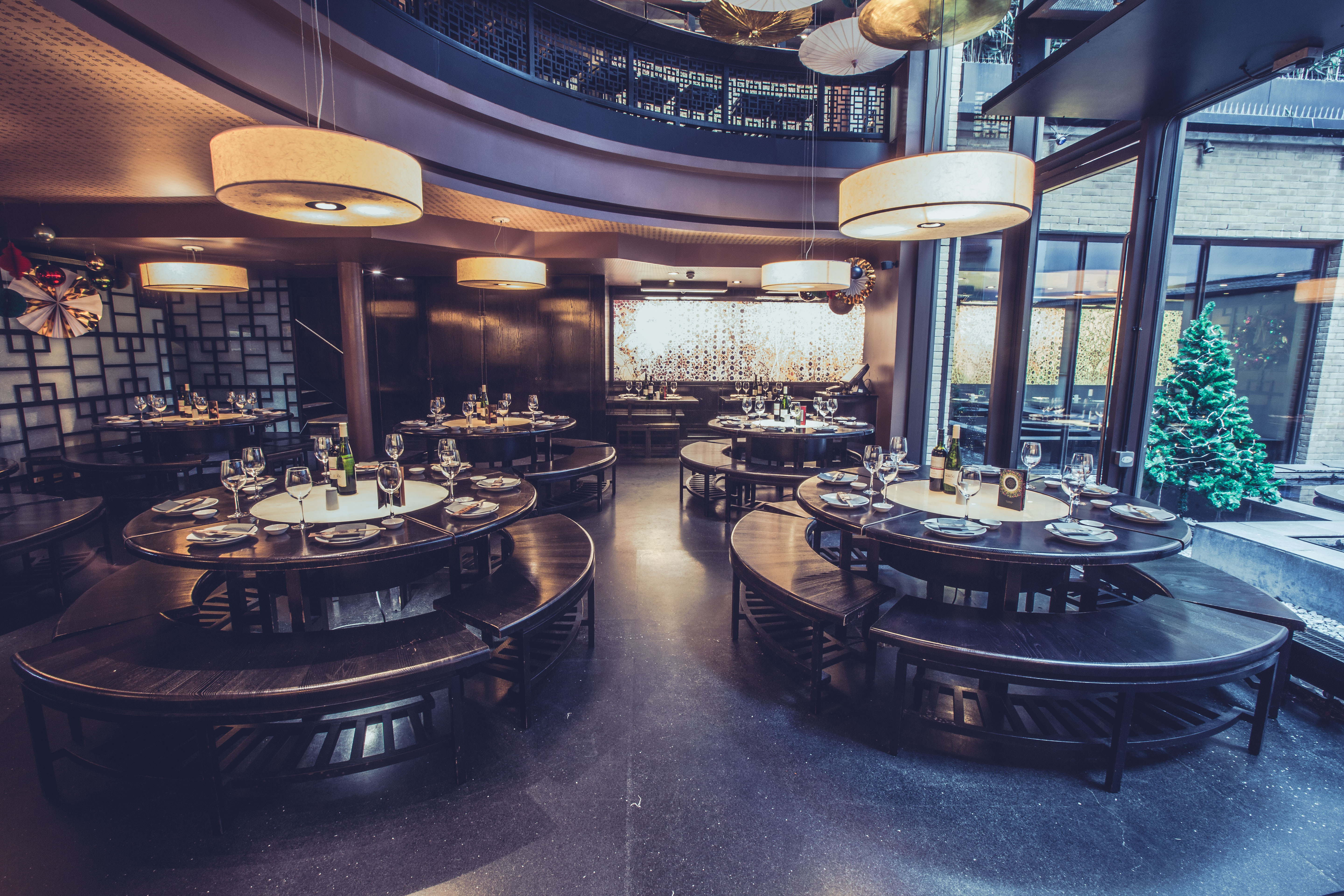 Stylish event space with circular tables for corporate gatherings and social events.