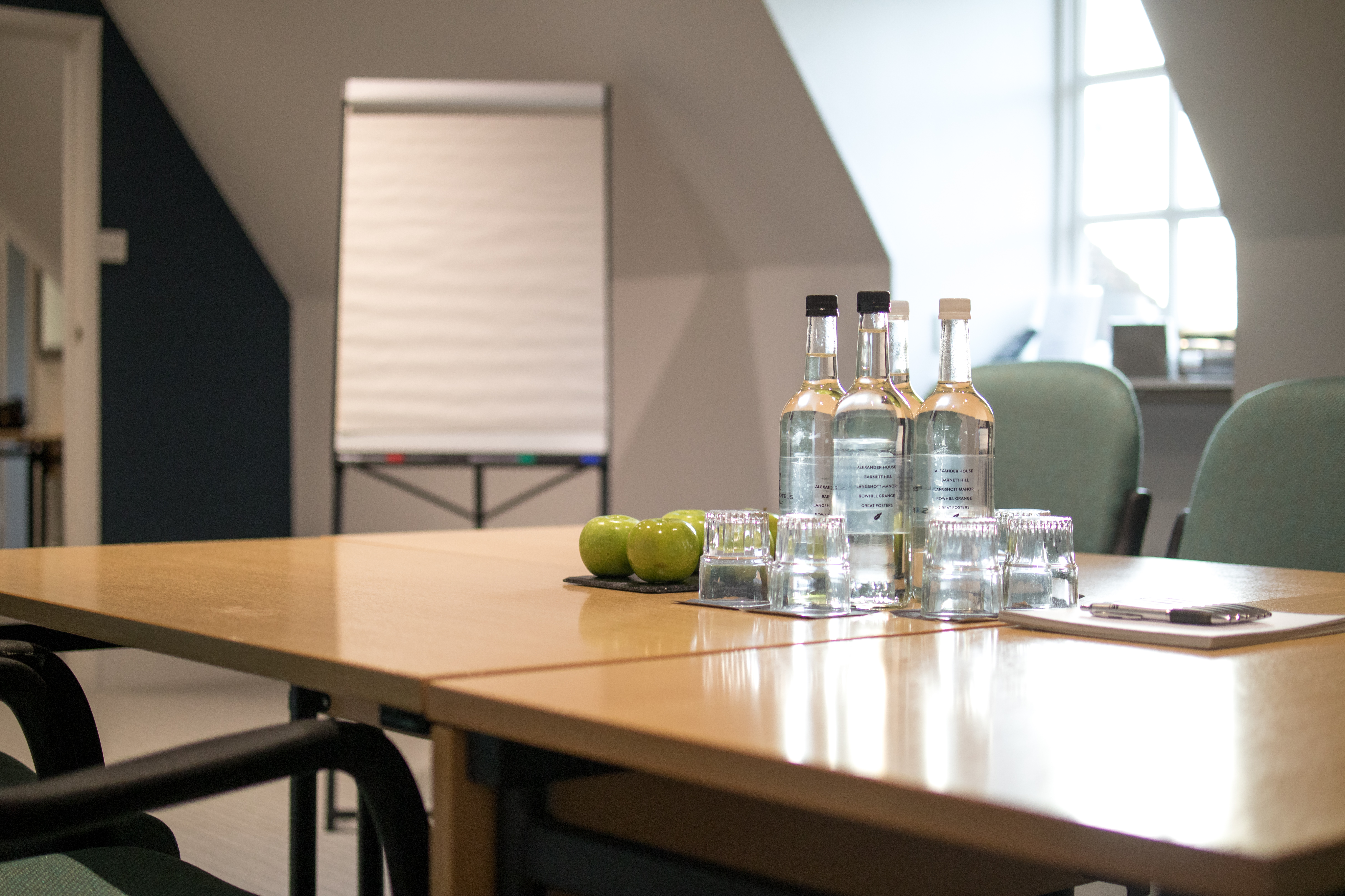Albury meeting space at Barnett Hill Hotel with clean table setup and flip chart.