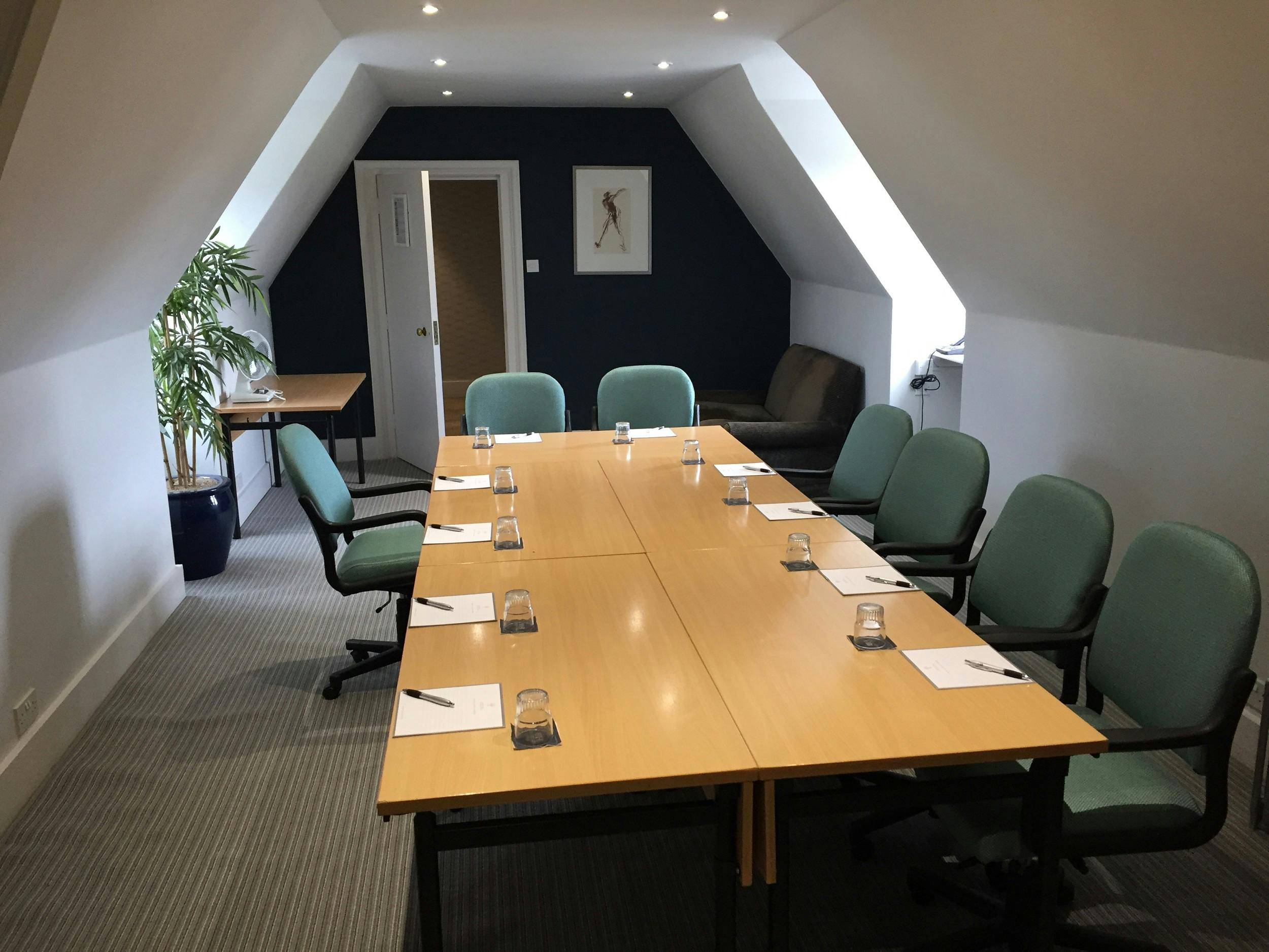 Albury meeting room at Barnett Hill Hotel with sloped ceiling, ideal for gatherings.