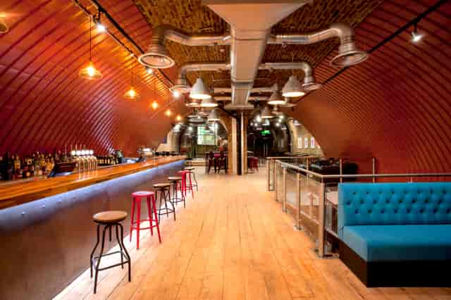 Stylish Upper Arch venue with warm wood tones, perfect for networking events and gatherings.