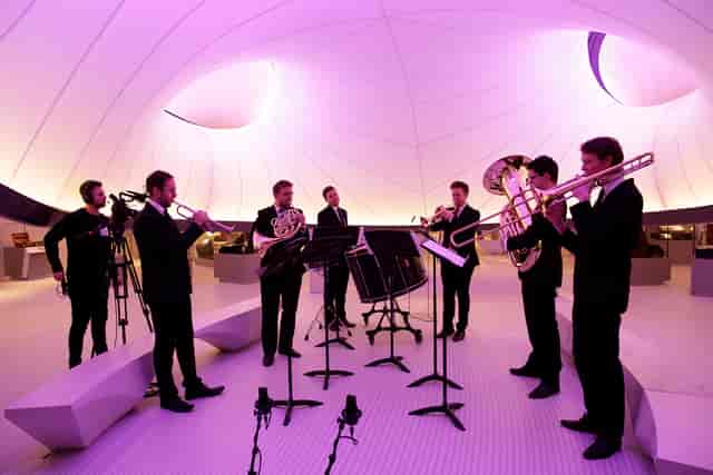 Sophisticated ensemble performing in elegant Winton Gallery, ideal for upscale events.