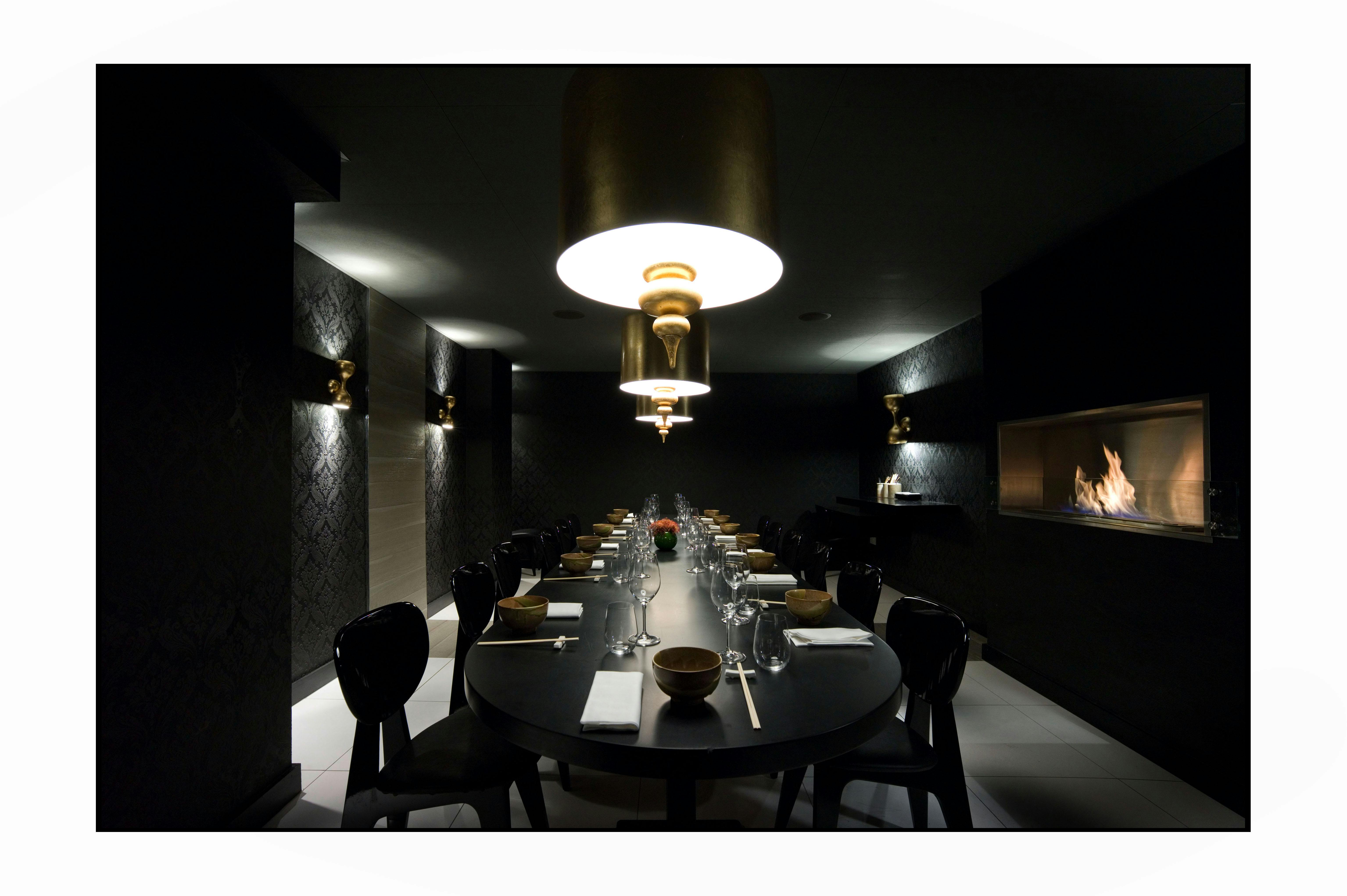 Elegant dining space with fireplace for intimate corporate dinners at Beaufort House Chelsea.