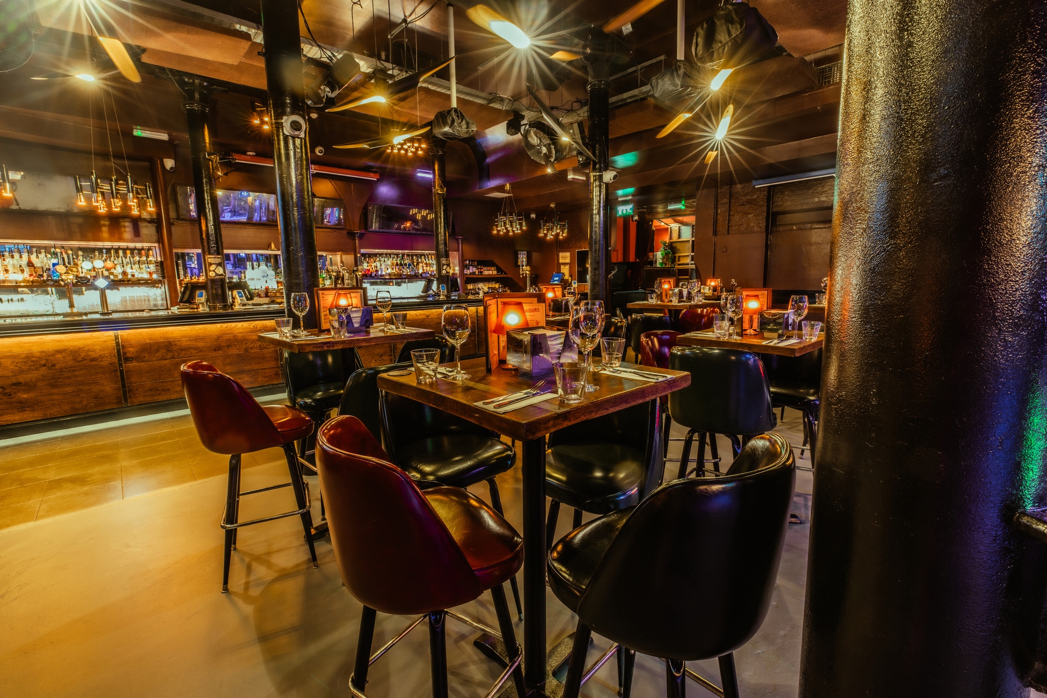 Stylish restaurant venue with warm lighting for corporate events and gatherings. - Banner