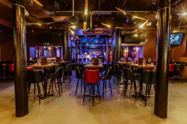 Versatile event space at The Piano Works Farringdon with high-top tables for networking.