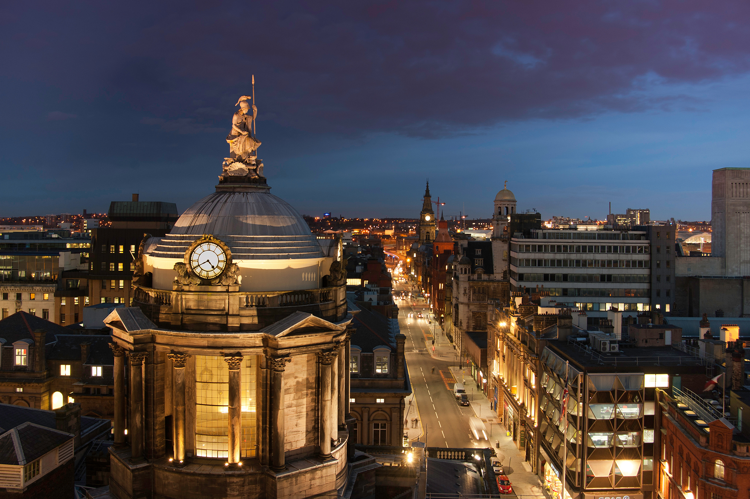 Liverpool Town Hall Main Ballroom at dusk, featuring a clock tower for gala events. - Banner