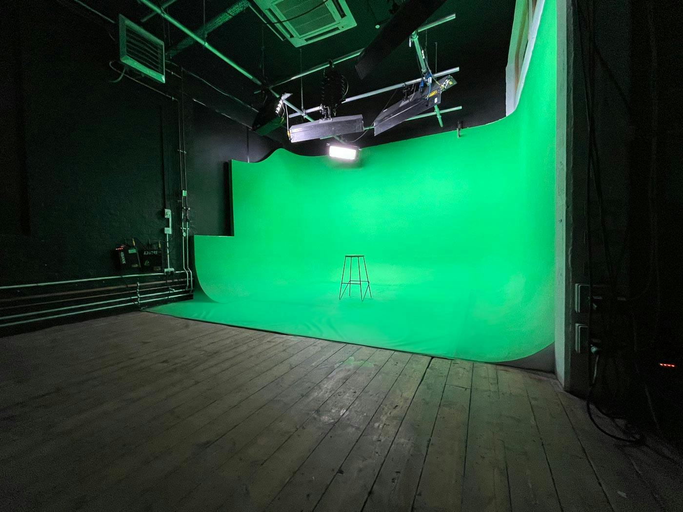 Versatile green screen studio for virtual events and presentations in Crixus Studios.