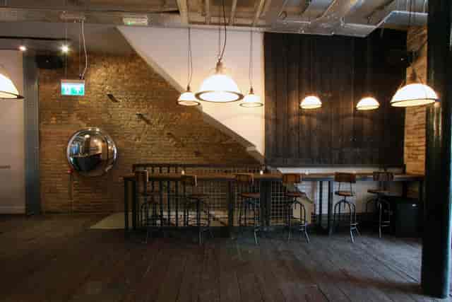 Industrial-chic breakout area at Iron Bloom Shoreditch for networking and corporate events.