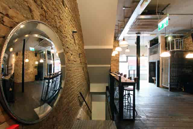 Industrial-chic Iron Bloom Shoreditch venue, exposed brick, ideal for networking and product launches.