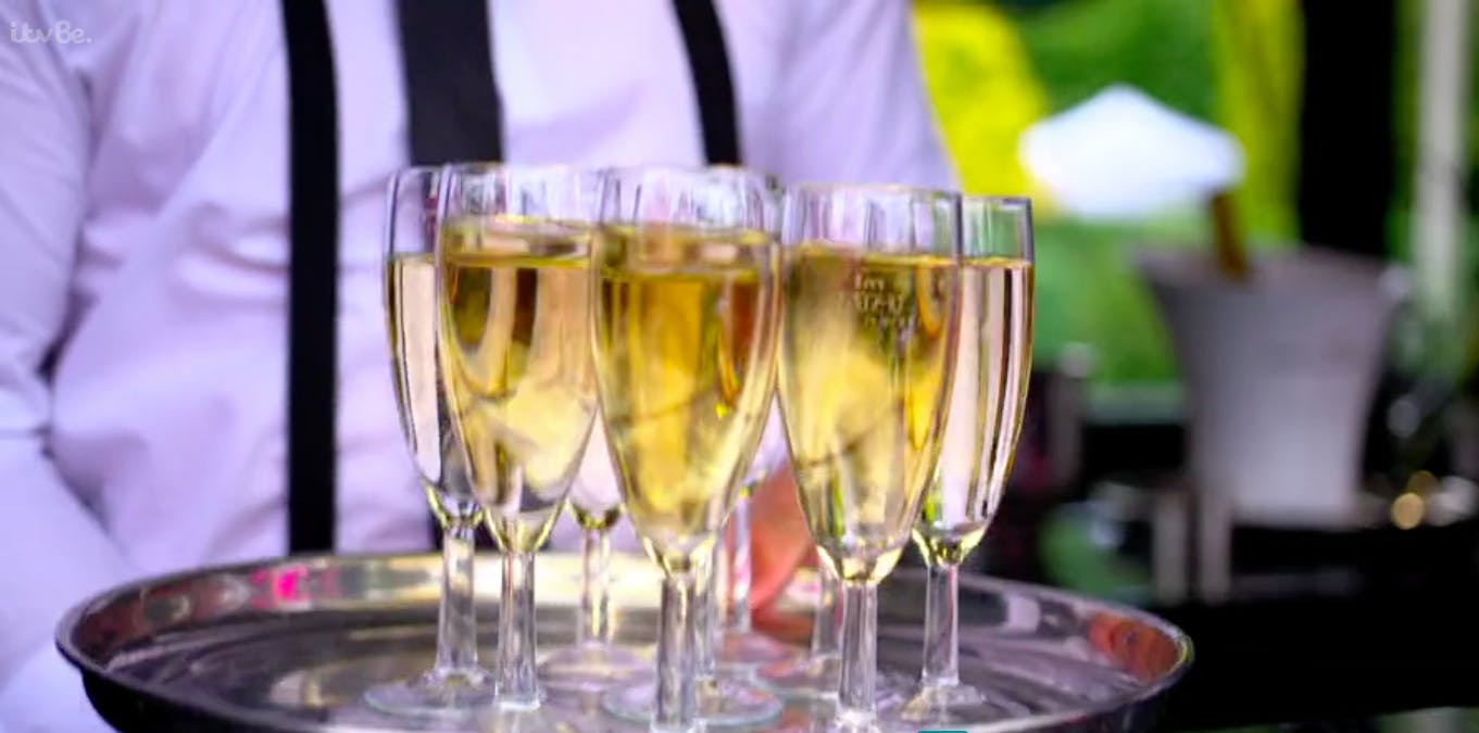 Elegant champagne flutes at VIP bus cash bar for sophisticated events and celebrations.
