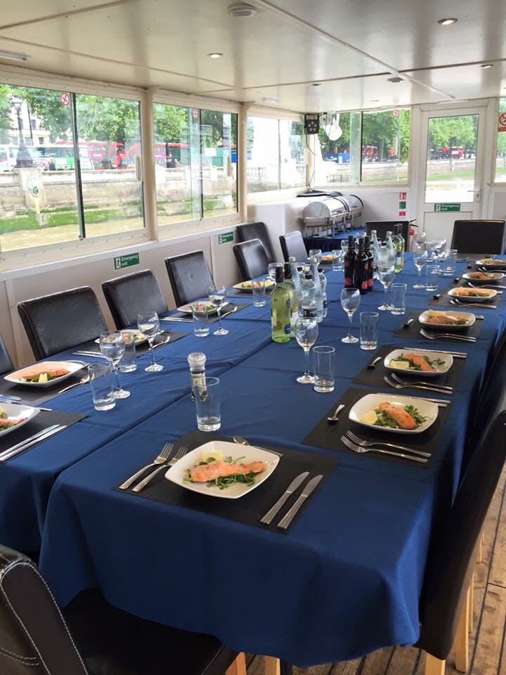 Elegant dining setup with salmon for a corporate event at MV Arcadian King Edward.