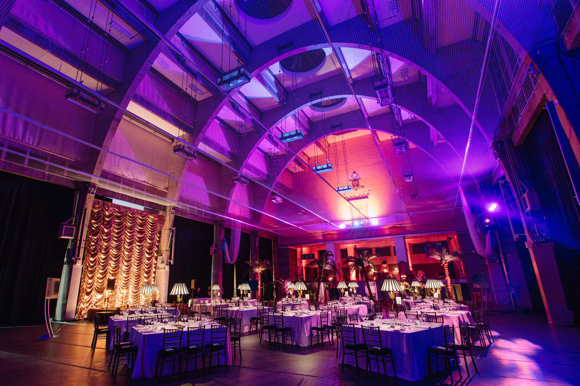 Elegant round tables in Lawrence Hall, perfect for upscale weddings and corporate events.