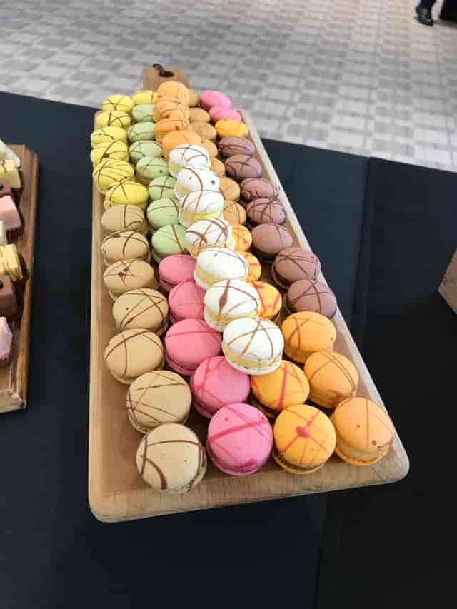 Colorful macarons display at King’s Hedges, perfect for elegant events and dessert tables.