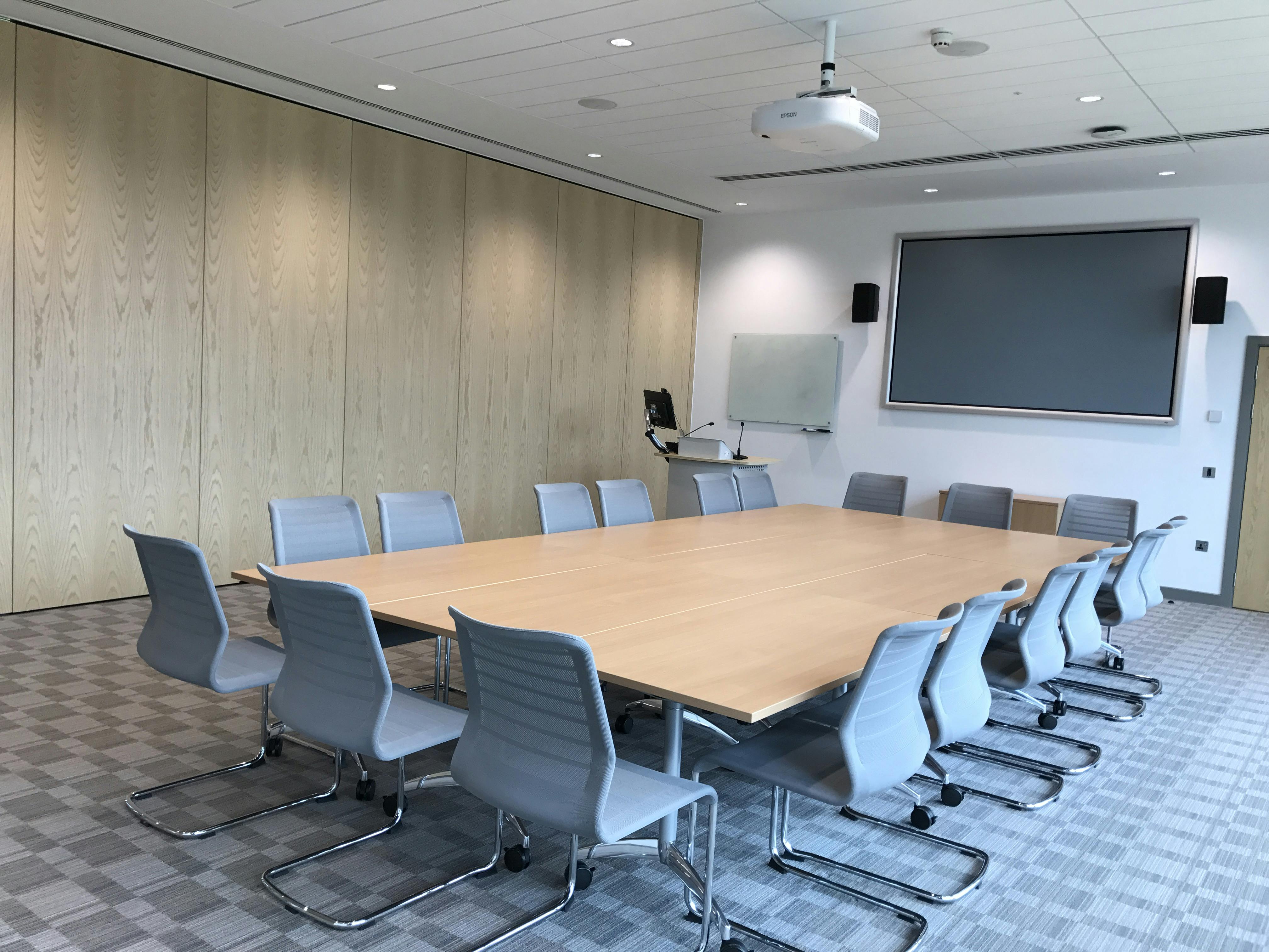 Modern conference room at Queen Edith's, featuring a large table for collaborative meetings.