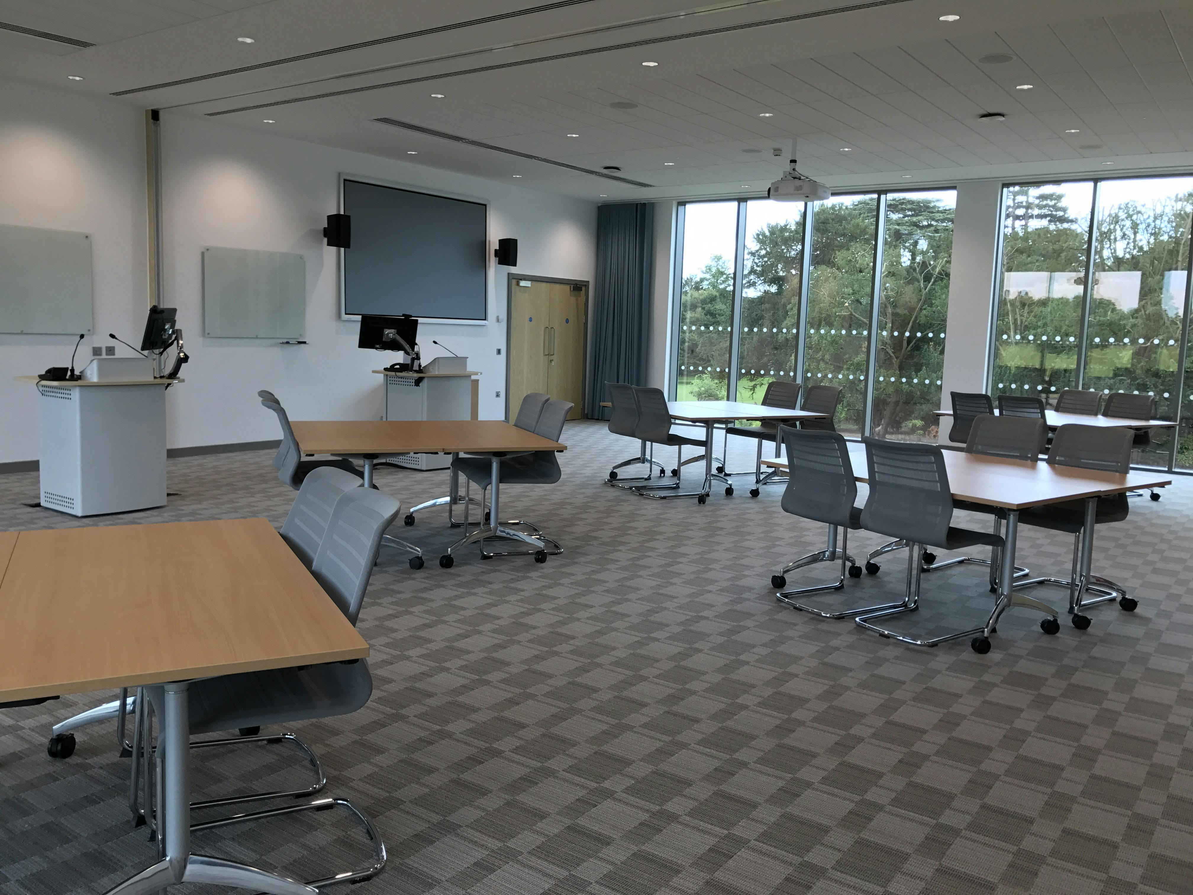 Modern meeting space at Queen Edith's, featuring flexible layout and natural light.