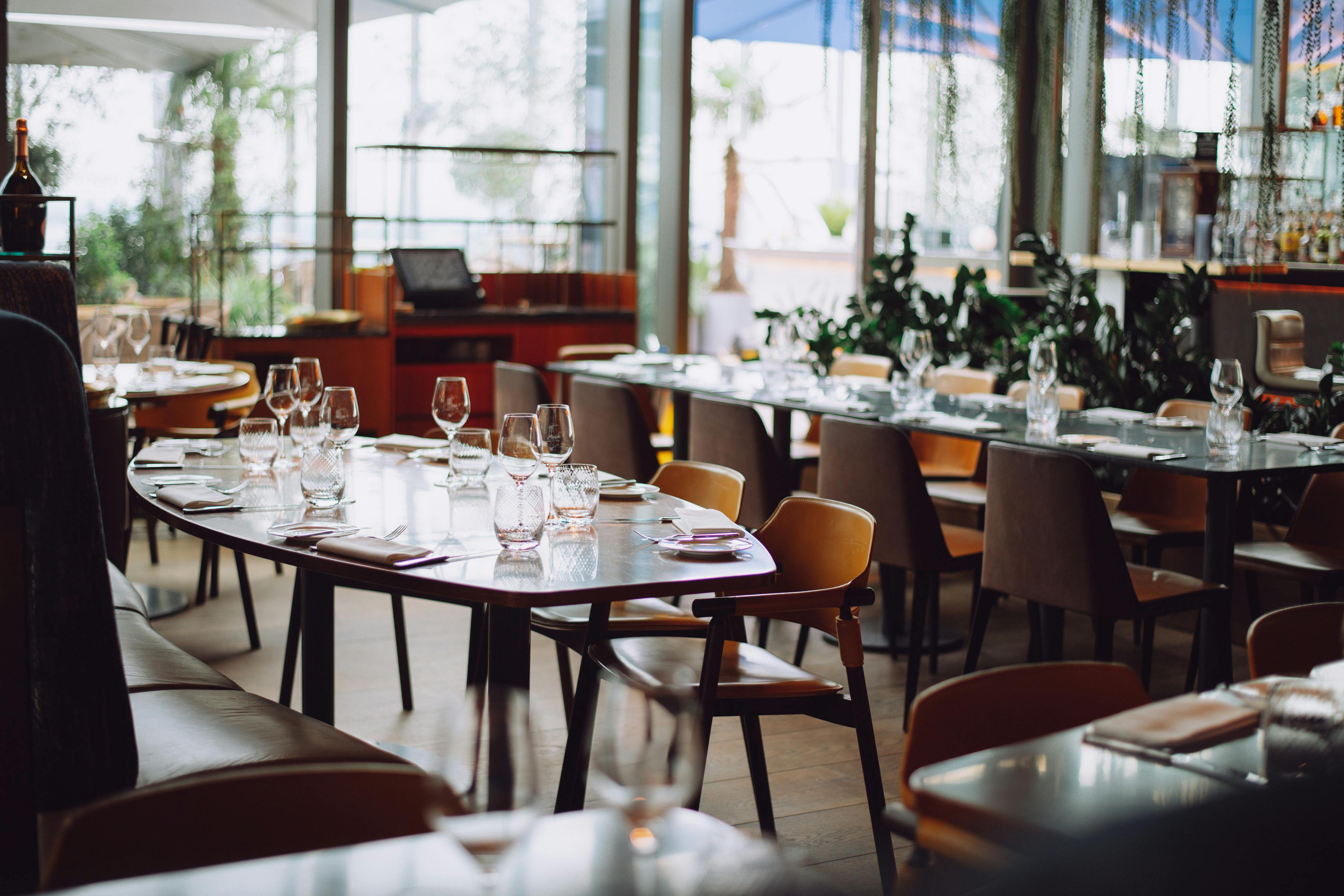 Elegant restaurant venue with stylish table settings for intimate meetings and events.