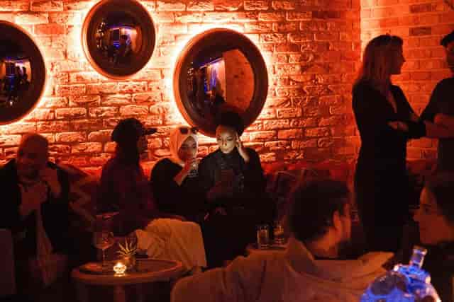 Kadies Club lounge with exposed brick, perfect for corporate networking and private event hire.