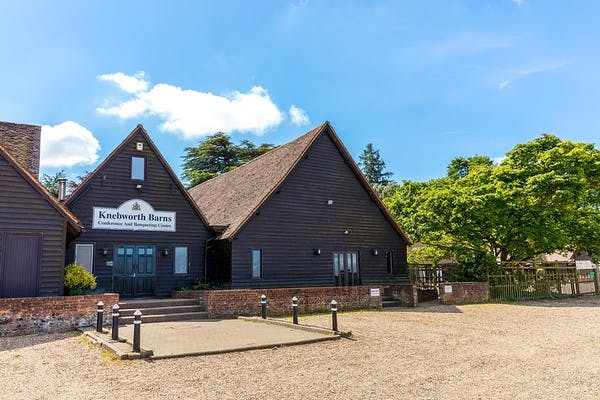 Lodge Barn at Knebworth House, rustic venue for meetings and weddings with thatched roof.