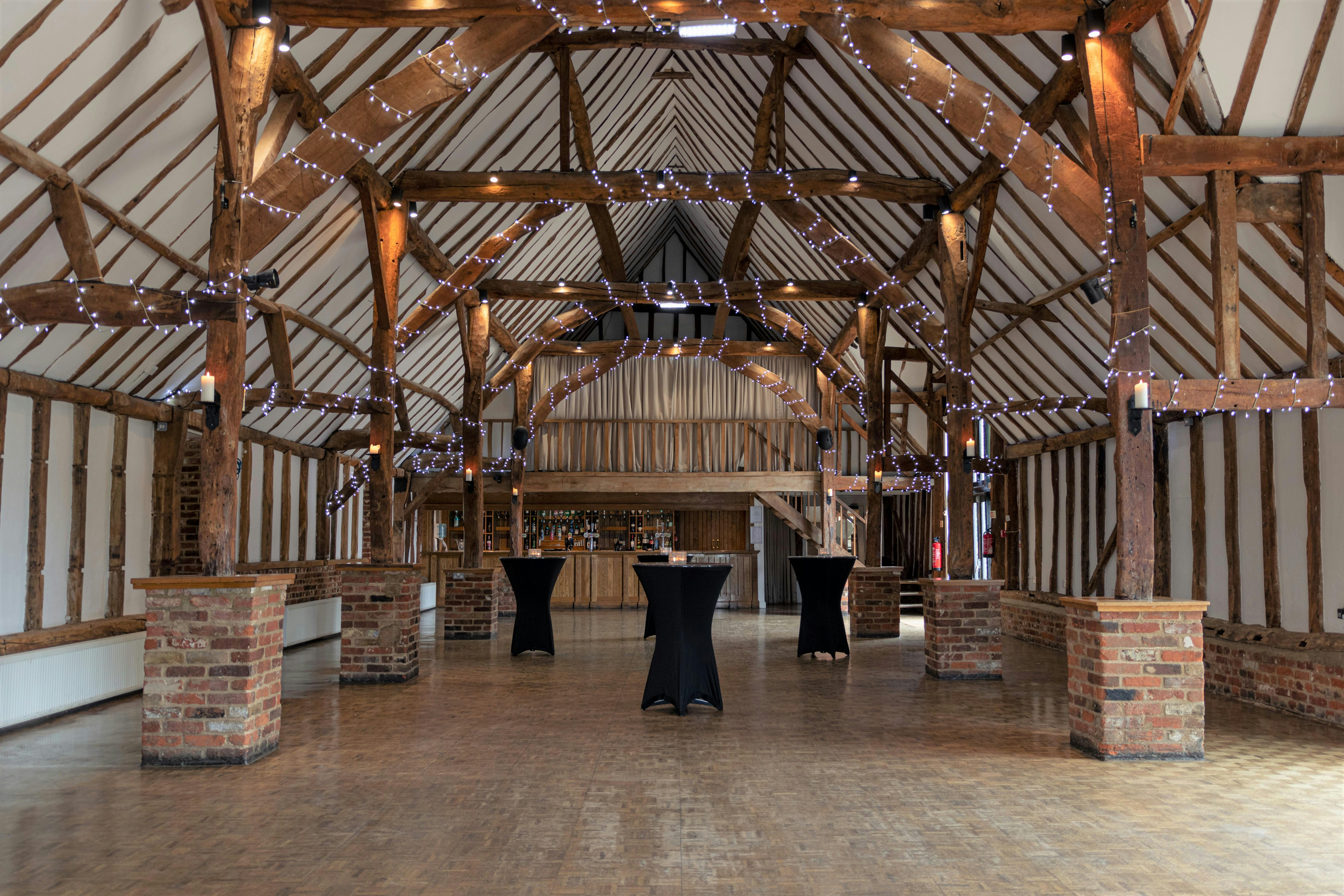 Lodge Barn at Knebworth House: rustic venue with exposed beams for events and receptions.