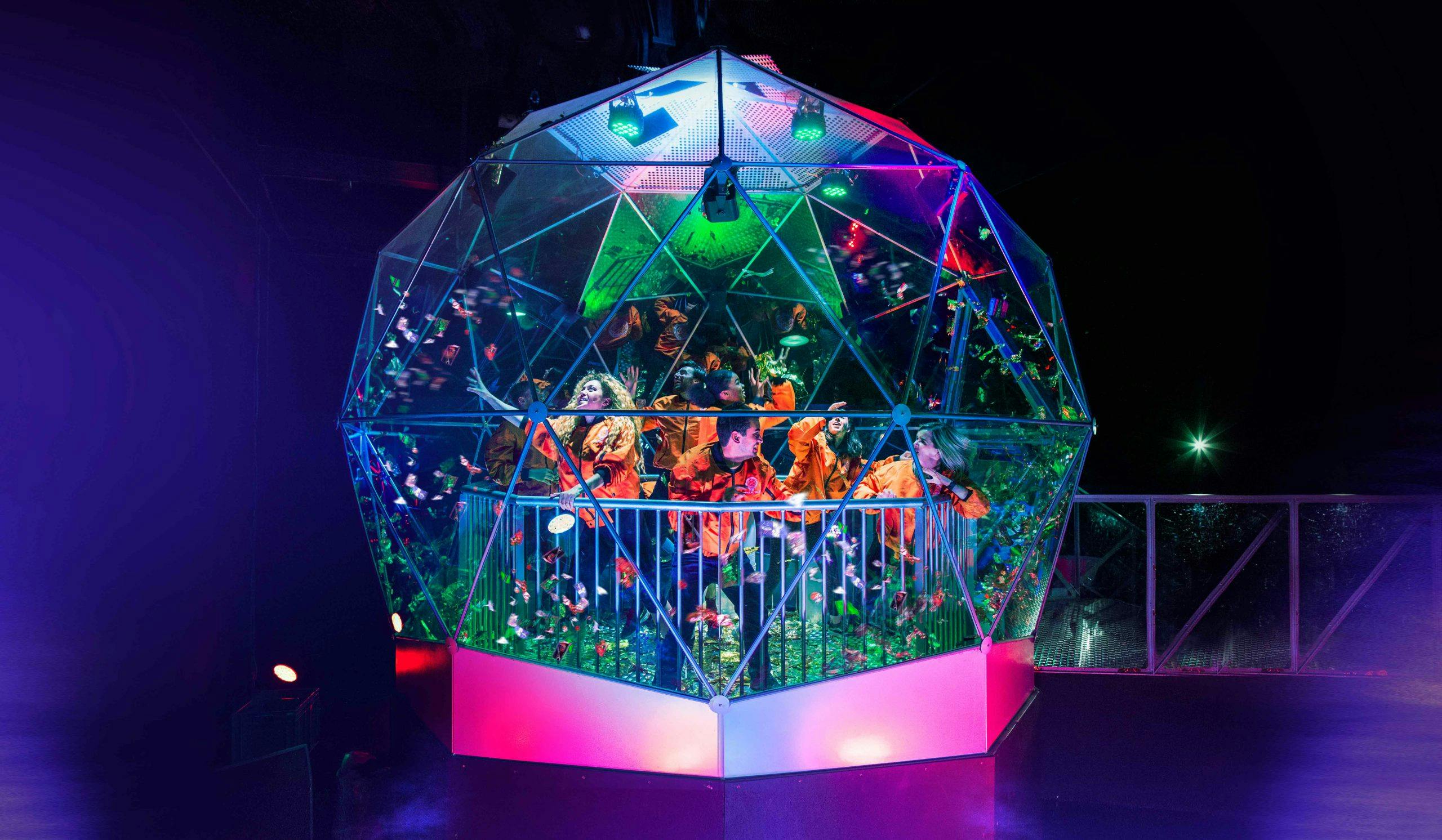 Immersive Crystal Maze venue with vibrant geometric design for team-building events.