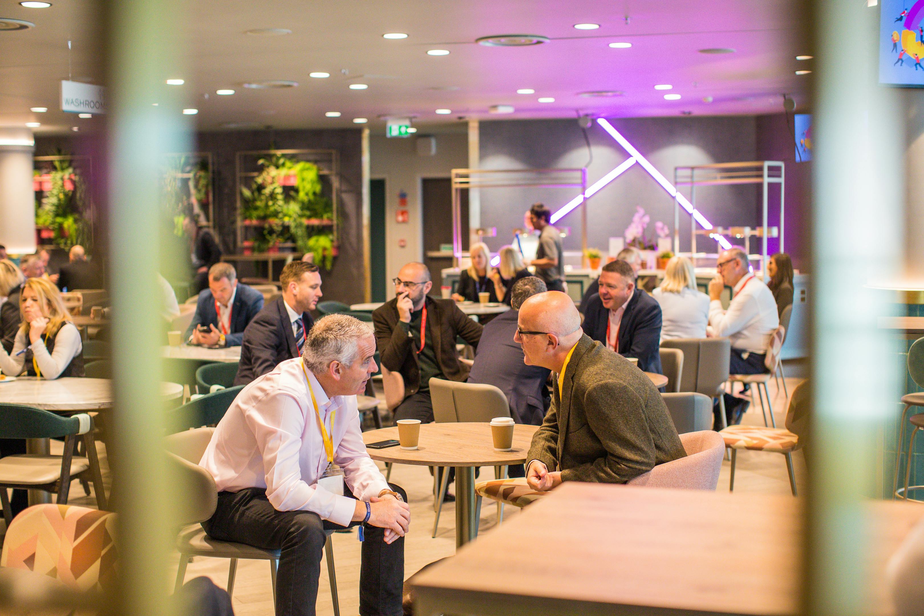 Vibrant networking space in Wembley Stadium's Atrium, ideal for events and collaboration.