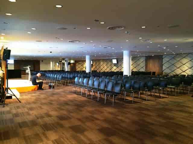 Wembley Suite theater conference room with A/V technician, ideal for corporate events and seminars.
