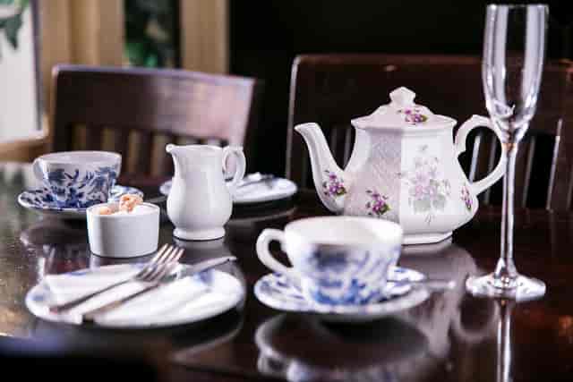 Elegant tea service setup with fine china in Irish Whisky Vault, Covent Garden.