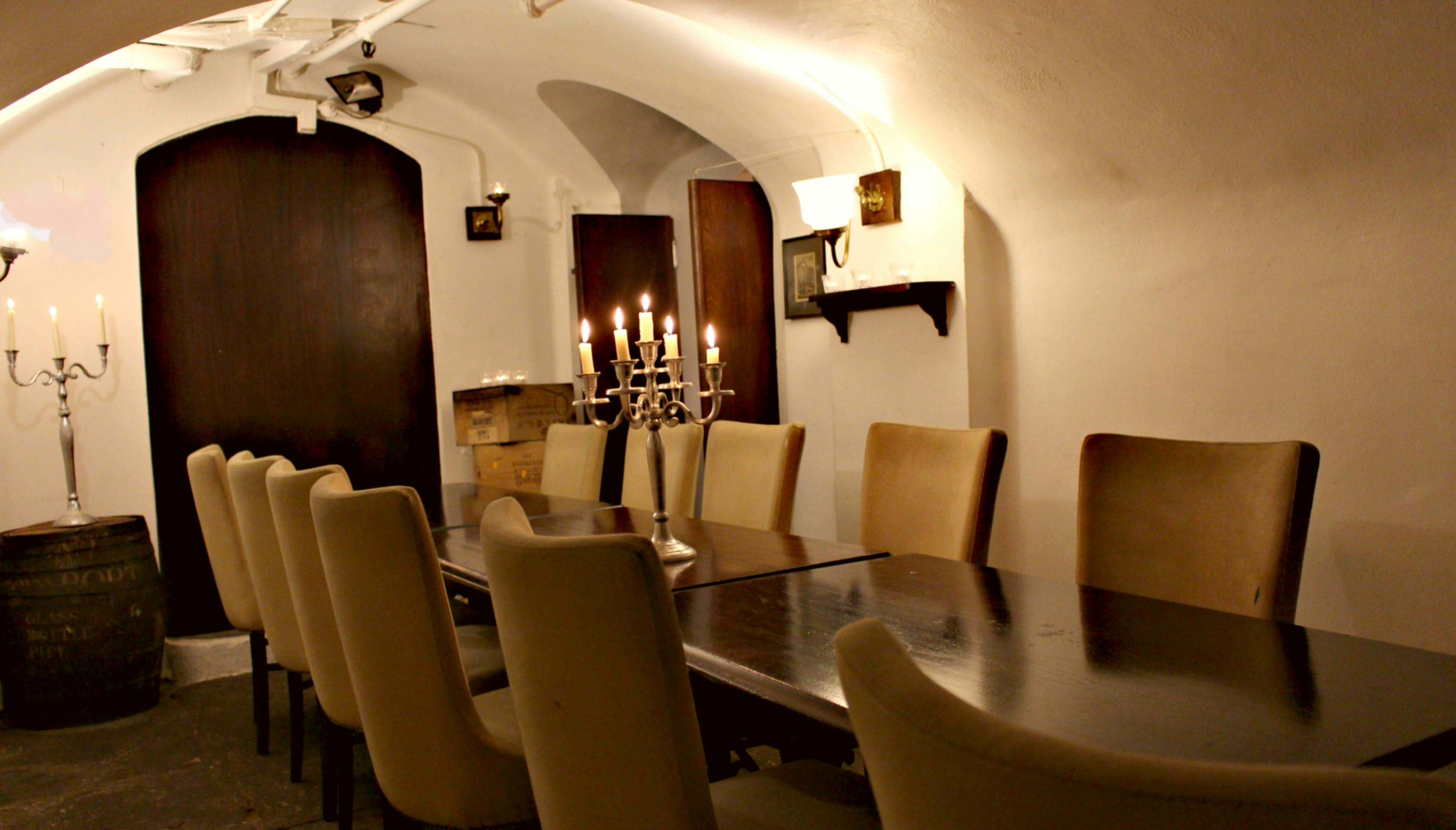 Irish Whisky Vault meeting space with elegant table, ideal for gatherings and events.