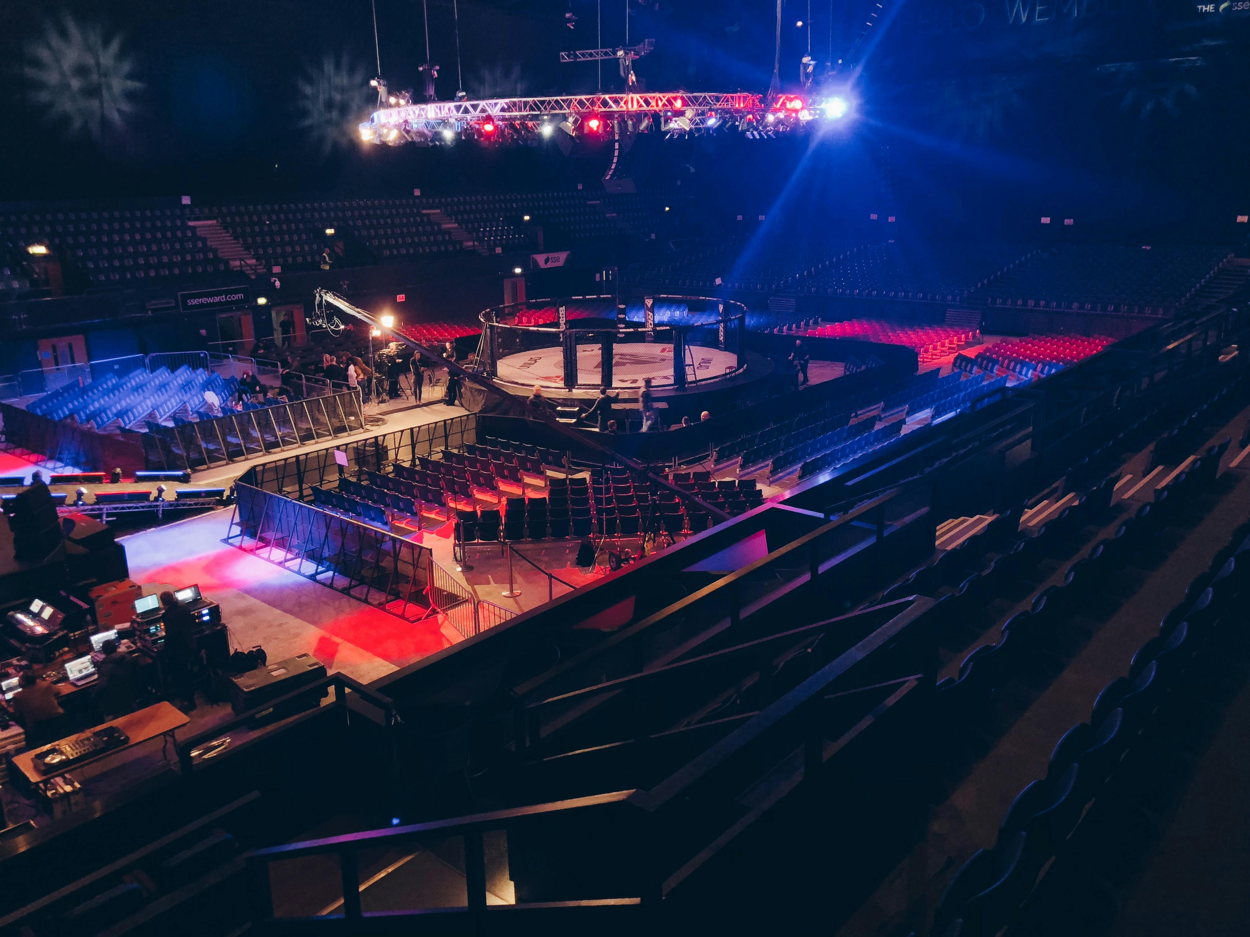 OVO Arena Wembley set for combat sports event with octagonal ring and tiered seating.
