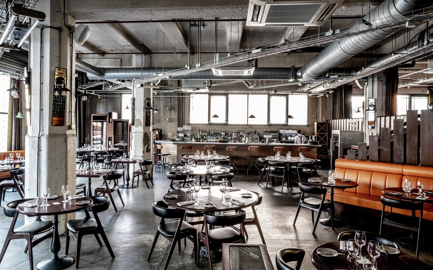 Modern restaurant venue with industrial decor for private events and meetings.