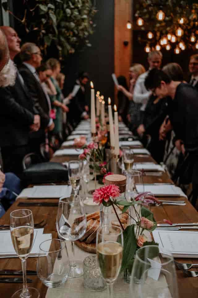 Elegant event space with candlelight and greenery for intimate gatherings.