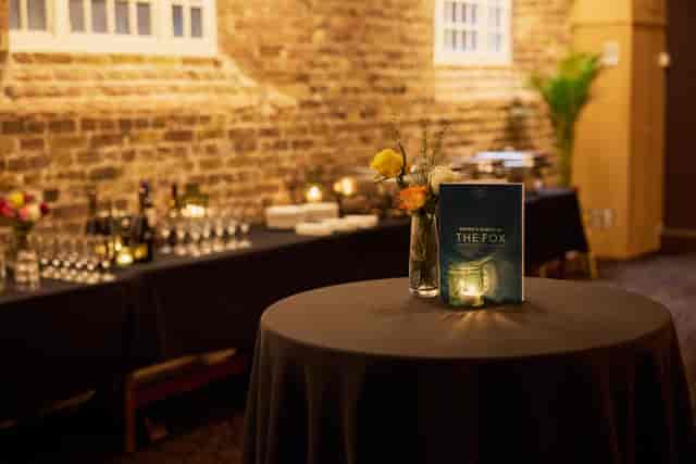 Basement Bar event reception setup with warm ambient lighting for cocktail parties and gala events.