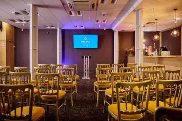 Basement Bar at Fox Excel: Theater-style event space with integrated bar for corporate networking.