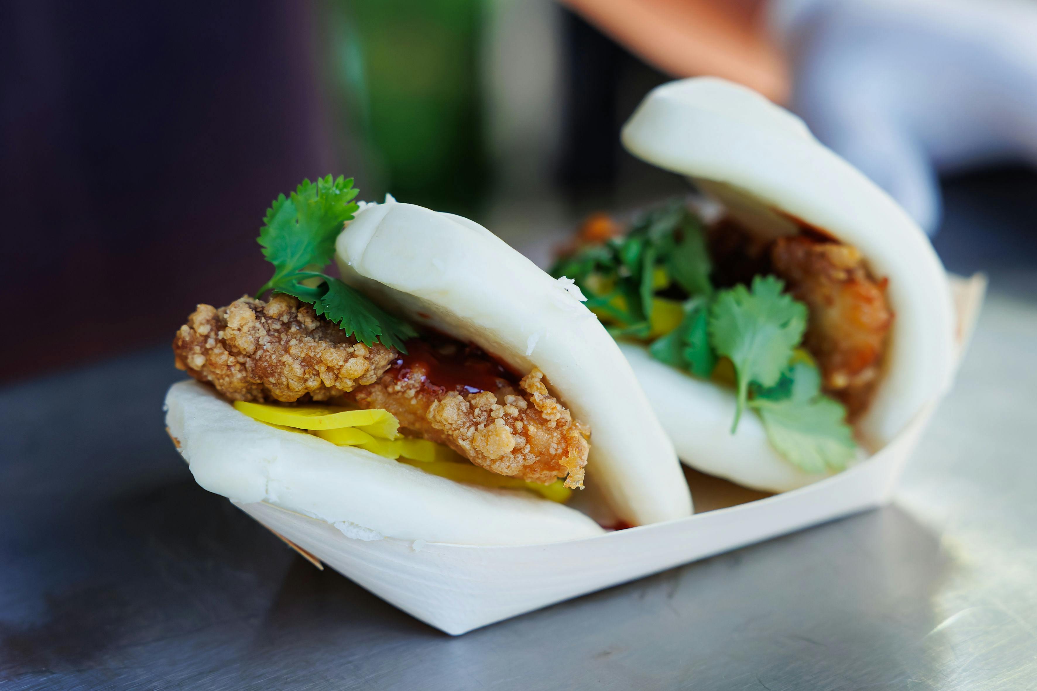 Crispy chicken bao buns in Shoreditch Gardens, perfect for event catering and receptions.