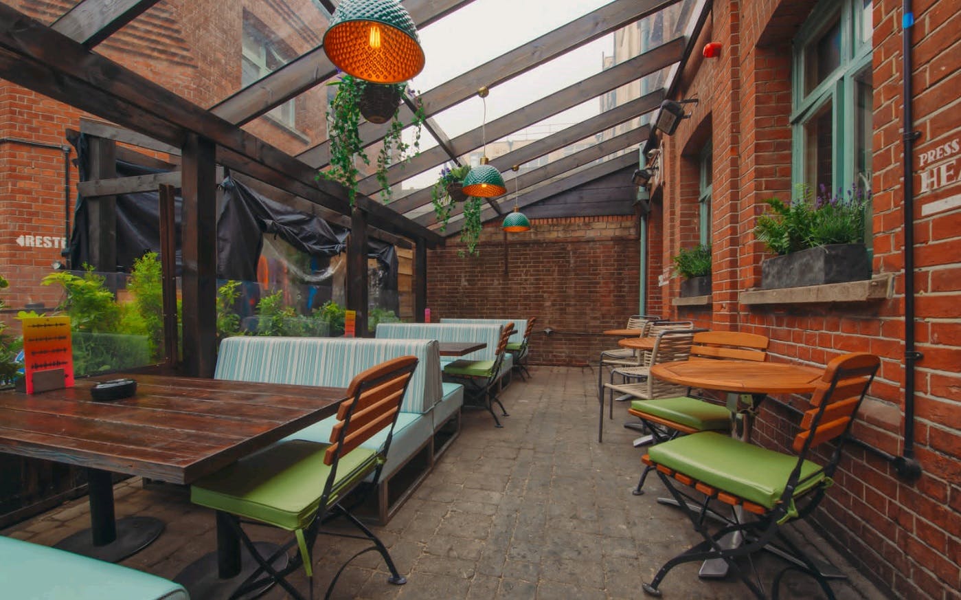 Charming outdoor courtyard with glass roof for casual meetings and events in Brighton.