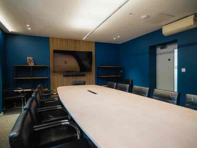 Modern conference room with oval table in FACT Liverpool for productive meetings.