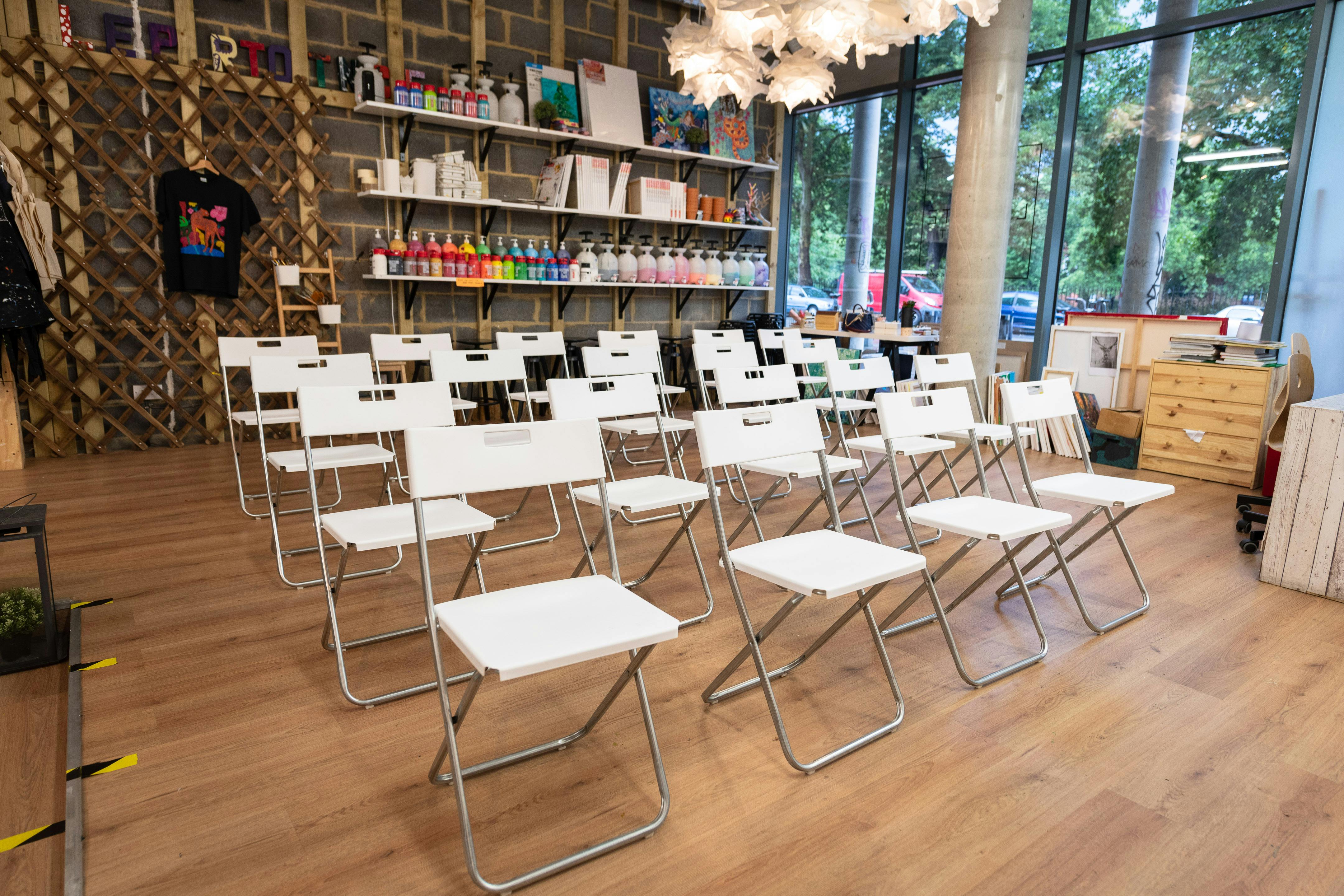 Whole Venue in Studio 249 with white chairs, ideal for workshops and meetings.