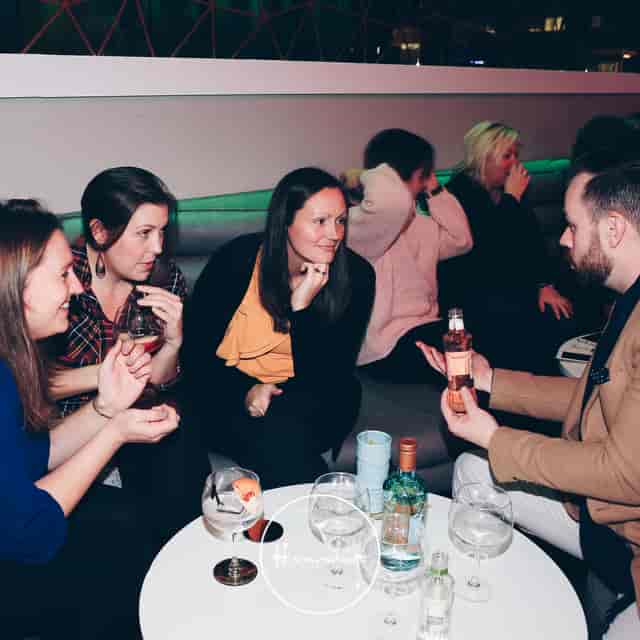 Vibrant networking event in a relaxed lounge setting fostering connections and collaboration.