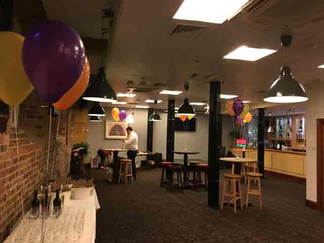 Private Bar at Fox Excel: Cocktail event setup with festive balloons and buffet for corporate party.